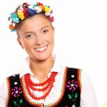 a portrait of a beautiful and hospitable polish woman in a traditional outfit e1618928877665