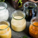 five jars of homemade salad dressing