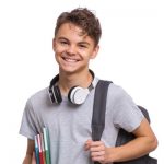 happy teen boy with headphones e1618580032967