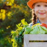 kids little girl holding basket fresh organic vegetables e1618901443353