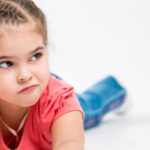 portrait of a beautiful little girl on a white background e1618728370466