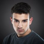 portrait of a serious young man looking at camera