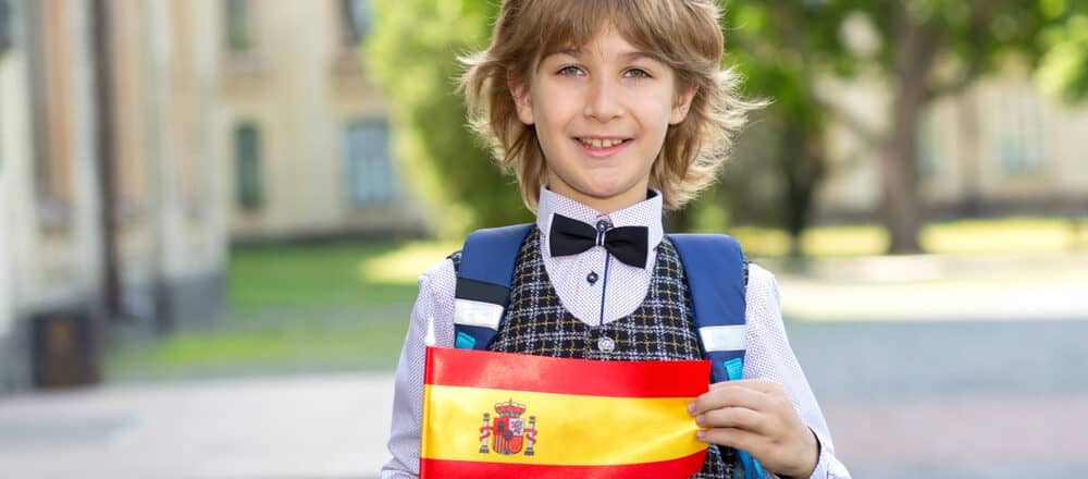 schoolboy with the flag of spain e1621061039894