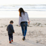 the two children playing in the basque country beach e1618382990522