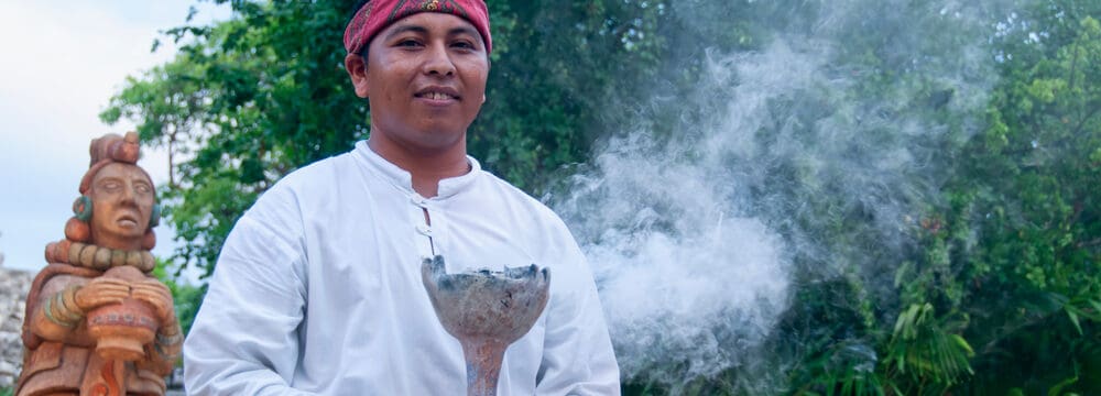 young mayan man in a ceremony e1619076465701