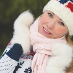 young woman in knitted hat with norwegian flag e1618985096762